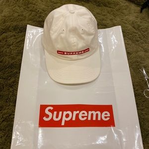 White Supreme cap. Free Supreme bag & sticker w/purchase.